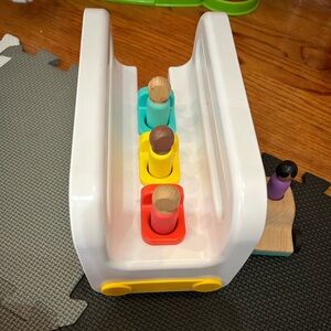 Lovevery bus and car with stick people